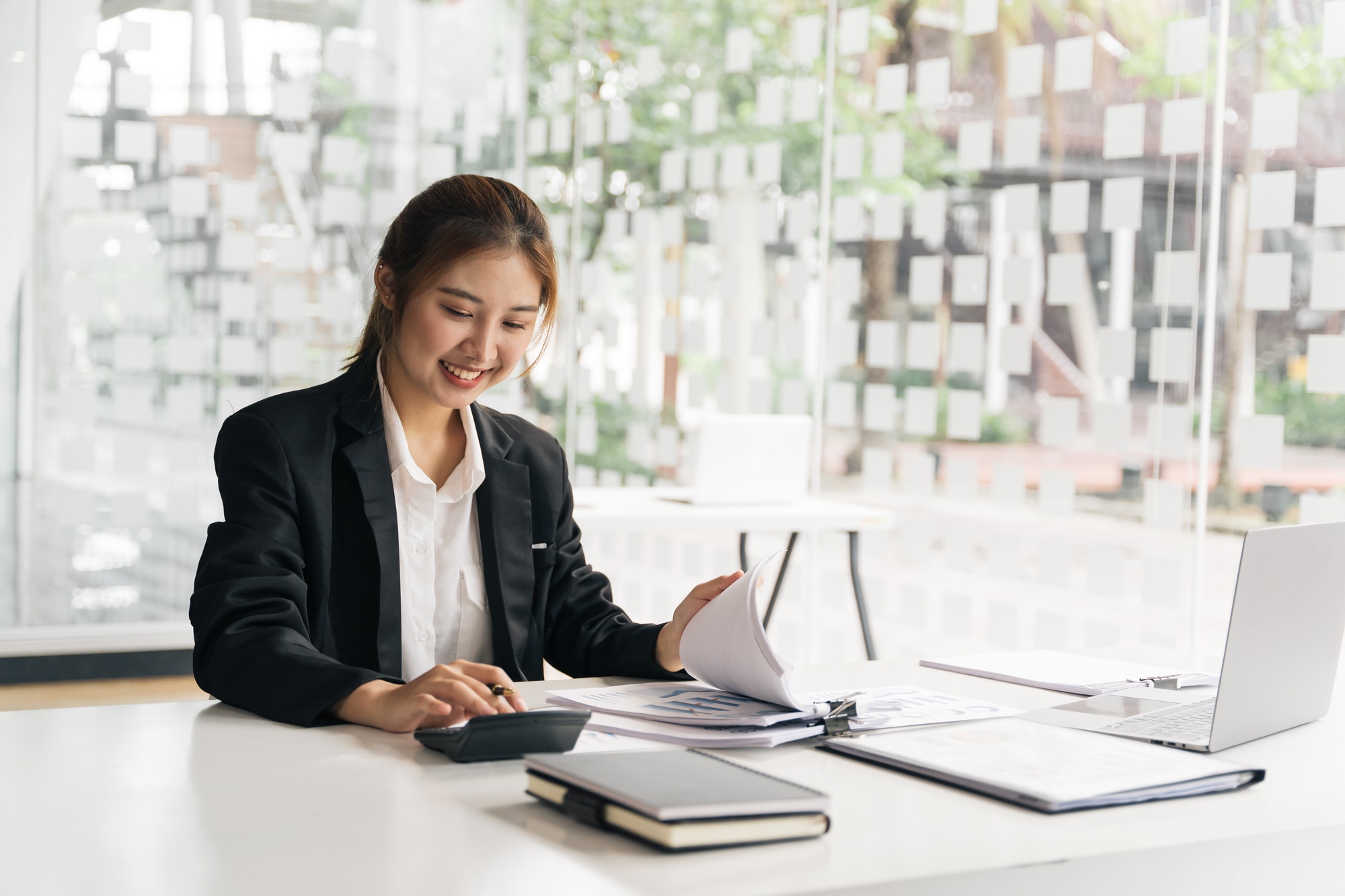 Business woman accountant or banker making calculations. Savings,Business Financing Accounting Business woman accountant or banker making calculations. Savings,Business Financing Accounting